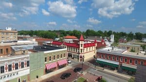 an aerial view of the main square in downtown Newberry, focusing on the red-roofed clock tower