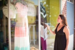 A woman is window-shopping in downtown Newberry